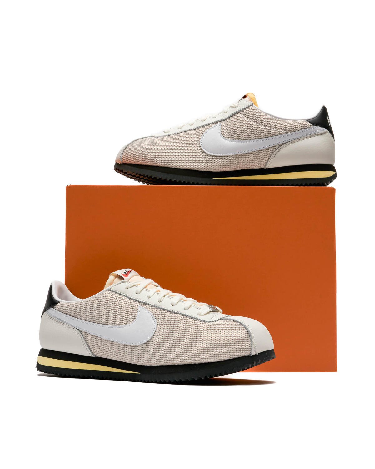 White and orange nike cortez hotsell